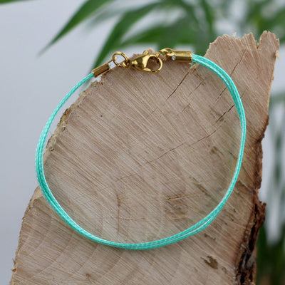 Upcycling-Armband aus Kiteleinen Turquoise/Gold - Armband